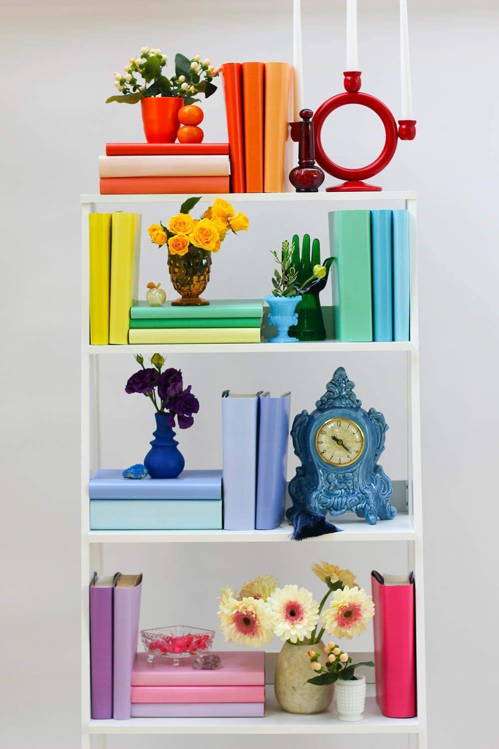 Styled rainbow book shelf with rainbow books from rainbow book covers  Edit alt text
