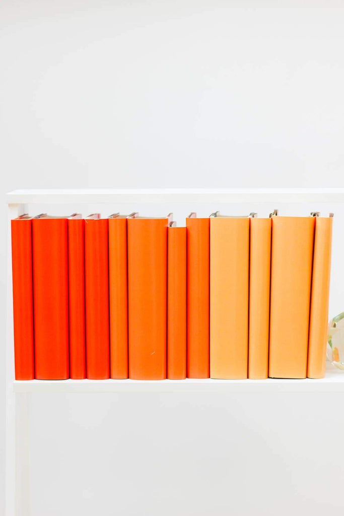 Set of styled orange books made with orange book covers