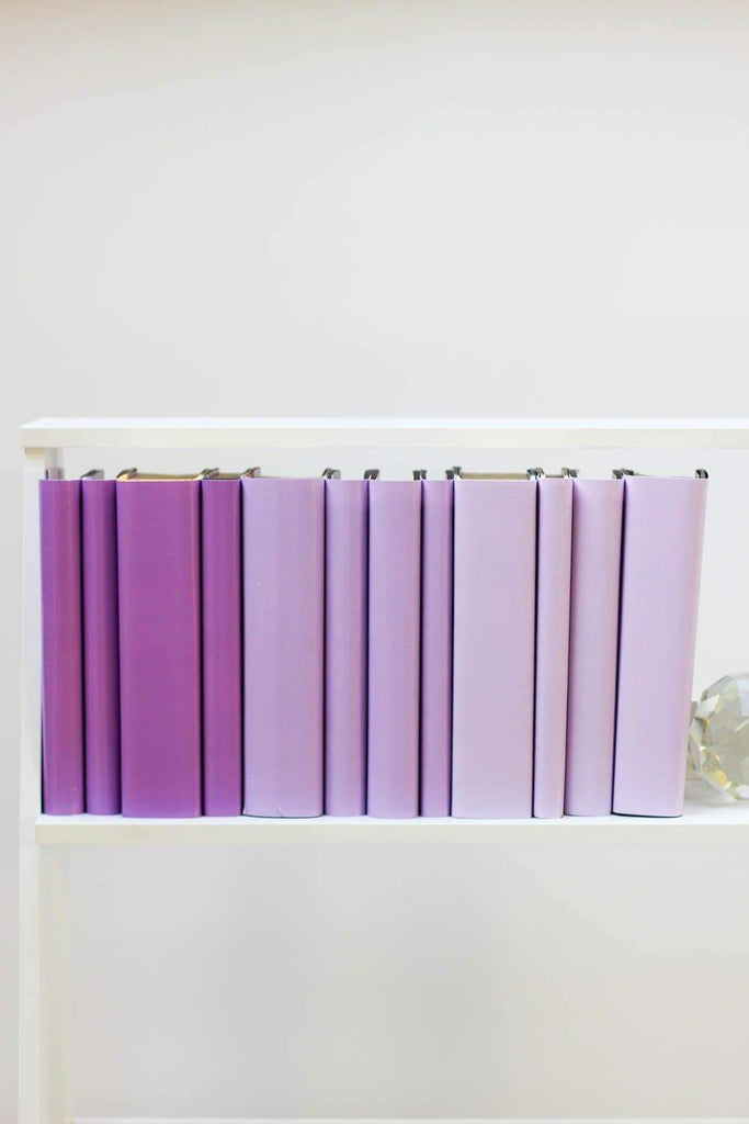 Set of styled purple books made with purple book covers