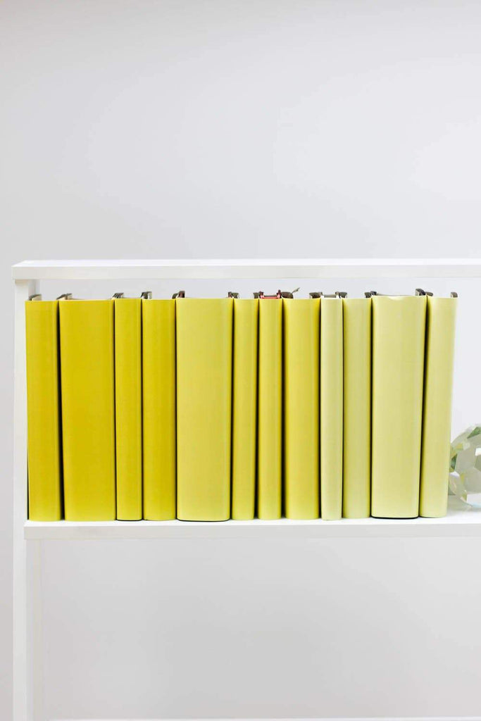 Set of styled yellow books made with yellow book covers