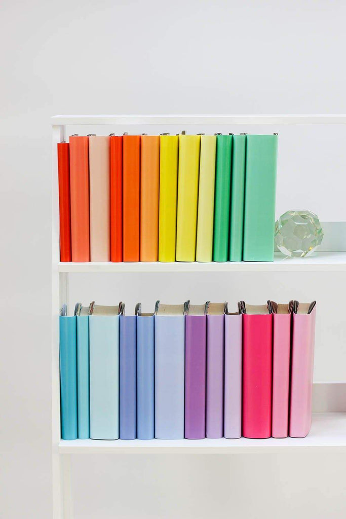 Set of styled rainbow books made with rainbow book covers